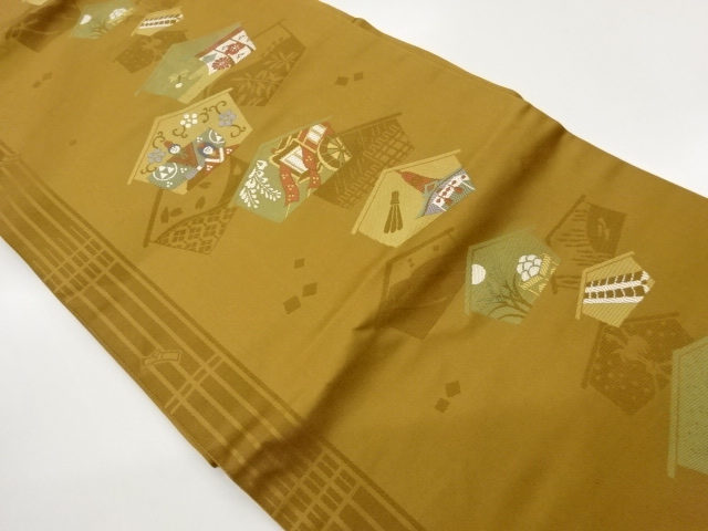 Nagoya obi woven with ema, hina dolls, and goshogawara design